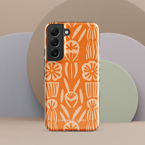 This stylish smartphone accessory, the Savannah Ardiente for Samsung by Statement Cases, features a shock-absorbing, colorful patterned case adorned with abstract flower designs in beige on an orange background. This impact-resistant phone case wraps around the back of your device, providing robust protection for its multiple camera lenses in the corner.