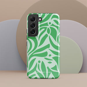 The Selva Verde for Samsung, a product by Statement Cases, is a durable, dual-layer phone case adorned with a green and white leafy design. The back of the case includes a camera cutout, and the bottom is printed with "Statement Cases.