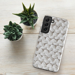 A Chunky Comfort for Samsung with a realistic knitted texture featuring white interwoven yarns. The impact-resistant case has multiple camera cutouts and a shock-absorbing dual-layer design. The brand name "Statement Cases" is printed at the bottom.