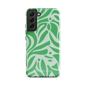 The Selva Verde for Samsung, a product by Statement Cases, is a durable, dual-layer phone case adorned with a green and white leafy design. The back of the case includes a camera cutout, and the bottom is printed with "Statement Cases.