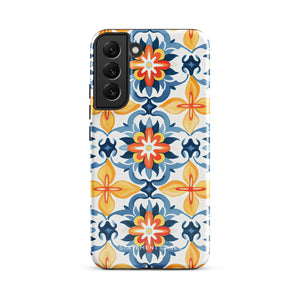 The Mediterranean Bloom for Samsung by Statement Cases features intricate, colorful floral patterns in blue, orange, and yellow. The design covers the entire back of the case, surrounding the camera cutout. Shock-absorbing and impact-resistant, it ensures protection while the brand "Statement Cases" is subtly printed near the bottom.