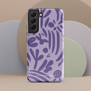 Introducing the Luna Morada for Samsung, a striking smartphone case from Statement Cases. This decorative purple cover boasts abstract floral and organic patterns in darker hues and is designed to absorb shocks. The impact-resistant case features a camera cutout that accommodates five lenses, with the brand name "STATEMENT CASES" elegantly printed at the bottom center.