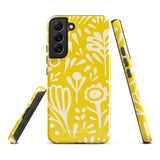 The Sol Dorado for Samsung by Statement Cases is a durable phone case featuring a bright yellow background adorned with an abstract white floral pattern, showcasing various flowers and leaves. Near the bottom edge, the text "STATEMENT CASE" highlights its dual-layer design for enhanced durability.