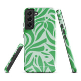 The Selva Verde for Samsung, a product by Statement Cases, is a durable, dual-layer phone case adorned with a green and white leafy design. The back of the case includes a camera cutout, and the bottom is printed with "Statement Cases.