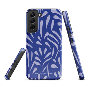 The Mariposa Azul for Samsung smartphone case from Statement Cases is adorned with an impact-resistant design featuring light purple abstract shapes on a blue background. This dual-layer case proudly displays the text "STATEMENT CASES" at the bottom, ensuring that the camera lenses and buttons of your phone remain clearly visible.