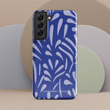 The Mariposa Azul for Samsung smartphone case from Statement Cases is adorned with an impact-resistant design featuring light purple abstract shapes on a blue background. This dual-layer case proudly displays the text "STATEMENT CASES" at the bottom, ensuring that the camera lenses and buttons of your phone remain clearly visible.