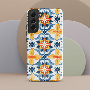 The Mediterranean Bloom for Samsung by Statement Cases features intricate, colorful floral patterns in blue, orange, and yellow. The design covers the entire back of the case, surrounding the camera cutout. Shock-absorbing and impact-resistant, it ensures protection while the brand "Statement Cases" is subtly printed near the bottom.