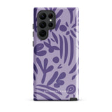 Introducing the Luna Morada for Samsung, a striking smartphone case from Statement Cases. This decorative purple cover boasts abstract floral and organic patterns in darker hues and is designed to absorb shocks. The impact-resistant case features a camera cutout that accommodates five lenses, with the brand name "STATEMENT CASES" elegantly printed at the bottom center.