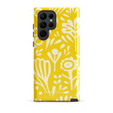 The Sol Dorado for Samsung by Statement Cases is a durable phone case featuring a bright yellow background adorned with an abstract white floral pattern, showcasing various flowers and leaves. Near the bottom edge, the text "STATEMENT CASE" highlights its dual-layer design for enhanced durability.