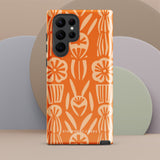 This stylish smartphone accessory, the Savannah Ardiente for Samsung by Statement Cases, features a shock-absorbing, colorful patterned case adorned with abstract flower designs in beige on an orange background. This impact-resistant phone case wraps around the back of your device, providing robust protection for its multiple camera lenses in the corner.