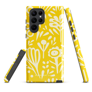 The Sol Dorado for Samsung by Statement Cases is a durable phone case featuring a bright yellow background adorned with an abstract white floral pattern, showcasing various flowers and leaves. Near the bottom edge, the text "STATEMENT CASE" highlights its dual-layer design for enhanced durability.