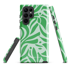 The Selva Verde for Samsung, a product by Statement Cases, is a durable, dual-layer phone case adorned with a green and white leafy design. The back of the case includes a camera cutout, and the bottom is printed with "Statement Cases.