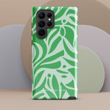 The Selva Verde for Samsung, a product by Statement Cases, is a durable, dual-layer phone case adorned with a green and white leafy design. The back of the case includes a camera cutout, and the bottom is printed with "Statement Cases.