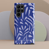 The Mariposa Azul for Samsung smartphone case from Statement Cases is adorned with an impact-resistant design featuring light purple abstract shapes on a blue background. This dual-layer case proudly displays the text "STATEMENT CASES" at the bottom, ensuring that the camera lenses and buttons of your phone remain clearly visible.