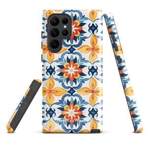 The Mediterranean Bloom for Samsung by Statement Cases features intricate, colorful floral patterns in blue, orange, and yellow. The design covers the entire back of the case, surrounding the camera cutout. Shock-absorbing and impact-resistant, it ensures protection while the brand "Statement Cases" is subtly printed near the bottom.