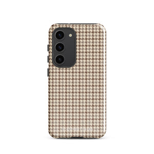 A Samsung smartphone with a beige and brown houndstooth patterned, impact-resistant case from Statement Cases. The phone features multiple cameras on the upper left side of its back. This tough Classic Houndstooth for Samsung phone case has a sleek, dual-layer design with precise cutouts for the cameras and buttons.