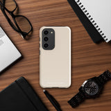 A beige smartphone case with vertical stripes designed for a phone with a triple camera setup. This impact-resistant phone case features precise cutouts for the cameras, buttons, and other essential functions. "Statement Cases" is printed at the bottom of the tough phone case. Product Name: Noble Pinstripe for Samsung