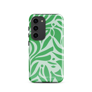 The Selva Verde for Samsung, a product by Statement Cases, is a durable, dual-layer phone case adorned with a green and white leafy design. The back of the case includes a camera cutout, and the bottom is printed with "Statement Cases.