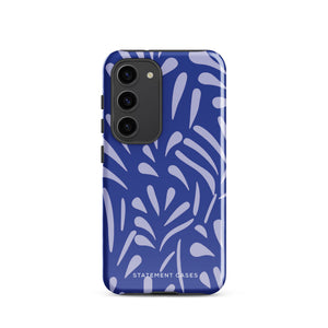 The Mariposa Azul for Samsung smartphone case from Statement Cases is adorned with an impact-resistant design featuring light purple abstract shapes on a blue background. This dual-layer case proudly displays the text "STATEMENT CASES" at the bottom, ensuring that the camera lenses and buttons of your phone remain clearly visible.