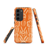 This stylish smartphone accessory, the Savannah Ardiente for Samsung by Statement Cases, features a shock-absorbing, colorful patterned case adorned with abstract flower designs in beige on an orange background. This impact-resistant phone case wraps around the back of your device, providing robust protection for its multiple camera lenses in the corner.