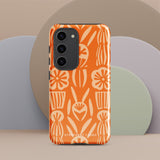 This stylish smartphone accessory, the Savannah Ardiente for Samsung by Statement Cases, features a shock-absorbing, colorful patterned case adorned with abstract flower designs in beige on an orange background. This impact-resistant phone case wraps around the back of your device, providing robust protection for its multiple camera lenses in the corner.