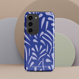 The Mariposa Azul for Samsung smartphone case from Statement Cases is adorned with an impact-resistant design featuring light purple abstract shapes on a blue background. This dual-layer case proudly displays the text "STATEMENT CASES" at the bottom, ensuring that the camera lenses and buttons of your phone remain clearly visible.