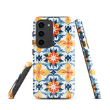 The Mediterranean Bloom for Samsung by Statement Cases features intricate, colorful floral patterns in blue, orange, and yellow. The design covers the entire back of the case, surrounding the camera cutout. Shock-absorbing and impact-resistant, it ensures protection while the brand "Statement Cases" is subtly printed near the bottom.