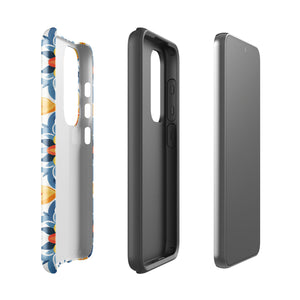 The Mediterranean Bloom for Samsung by Statement Cases features intricate, colorful floral patterns in blue, orange, and yellow. The design covers the entire back of the case, surrounding the camera cutout. Shock-absorbing and impact-resistant, it ensures protection while the brand "Statement Cases" is subtly printed near the bottom.