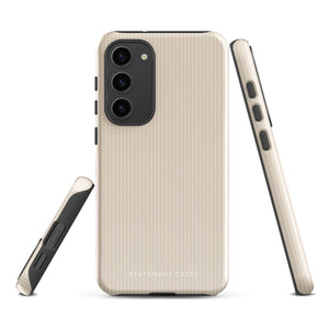 A beige smartphone case with vertical stripes designed for a phone with a triple camera setup. This impact-resistant phone case features precise cutouts for the cameras, buttons, and other essential functions. "Statement Cases" is printed at the bottom of the tough phone case. Product Name: Noble Pinstripe for Samsung