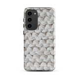 A Chunky Comfort for Samsung with a realistic knitted texture featuring white interwoven yarns. The impact-resistant case has multiple camera cutouts and a shock-absorbing dual-layer design. The brand name "Statement Cases" is printed at the bottom.