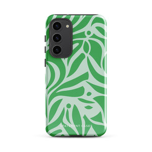 The Selva Verde for Samsung, a product by Statement Cases, is a durable, dual-layer phone case adorned with a green and white leafy design. The back of the case includes a camera cutout, and the bottom is printed with "Statement Cases.