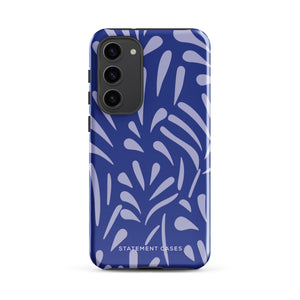 The Mariposa Azul for Samsung smartphone case from Statement Cases is adorned with an impact-resistant design featuring light purple abstract shapes on a blue background. This dual-layer case proudly displays the text "STATEMENT CASES" at the bottom, ensuring that the camera lenses and buttons of your phone remain clearly visible.