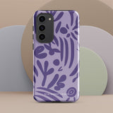 Introducing the Luna Morada for Samsung, a striking smartphone case from Statement Cases. This decorative purple cover boasts abstract floral and organic patterns in darker hues and is designed to absorb shocks. The impact-resistant case features a camera cutout that accommodates five lenses, with the brand name "STATEMENT CASES" elegantly printed at the bottom center.