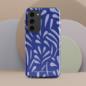 The Mariposa Azul for Samsung smartphone case from Statement Cases is adorned with an impact-resistant design featuring light purple abstract shapes on a blue background. This dual-layer case proudly displays the text "STATEMENT CASES" at the bottom, ensuring that the camera lenses and buttons of your phone remain clearly visible.