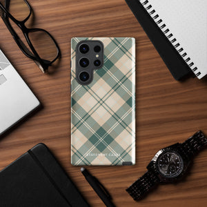 A dual-layer phone case featuring a checked plaid design in shades of green, beige, and white. The pattern consists of intersecting horizontal and vertical lines forming squares and diamonds. This impact-resistant Aristocrats Plaid for Samsung from Statement Cases is shown on a white background.