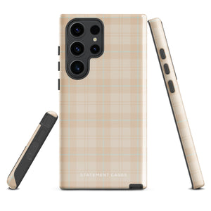 A smartphone with an impact-resistant beige plaid phone case featuring subtle light blue accents. The camera, flash, and sensor modules are visible at the top. The bottom part of the case has the text "Sophisticated Plaid for Samsung" printed on it by Statement Cases.