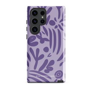 Introducing the Luna Morada for Samsung, a striking smartphone case from Statement Cases. This decorative purple cover boasts abstract floral and organic patterns in darker hues and is designed to absorb shocks. The impact-resistant case features a camera cutout that accommodates five lenses, with the brand name "STATEMENT CASES" elegantly printed at the bottom center.