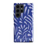 The Mariposa Azul for Samsung smartphone case from Statement Cases is adorned with an impact-resistant design featuring light purple abstract shapes on a blue background. This dual-layer case proudly displays the text "STATEMENT CASES" at the bottom, ensuring that the camera lenses and buttons of your phone remain clearly visible.