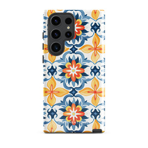 The Mediterranean Bloom for Samsung by Statement Cases features intricate, colorful floral patterns in blue, orange, and yellow. The design covers the entire back of the case, surrounding the camera cutout. Shock-absorbing and impact-resistant, it ensures protection while the brand "Statement Cases" is subtly printed near the bottom.