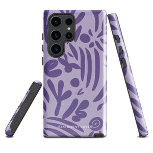 Introducing the Luna Morada for Samsung, a striking smartphone case from Statement Cases. This decorative purple cover boasts abstract floral and organic patterns in darker hues and is designed to absorb shocks. The impact-resistant case features a camera cutout that accommodates five lenses, with the brand name "STATEMENT CASES" elegantly printed at the bottom center.