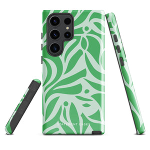 The Selva Verde for Samsung, a product by Statement Cases, is a durable, dual-layer phone case adorned with a green and white leafy design. The back of the case includes a camera cutout, and the bottom is printed with "Statement Cases.