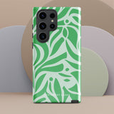 The Selva Verde for Samsung, a product by Statement Cases, is a durable, dual-layer phone case adorned with a green and white leafy design. The back of the case includes a camera cutout, and the bottom is printed with "Statement Cases.