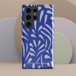 The Mariposa Azul for Samsung smartphone case from Statement Cases is adorned with an impact-resistant design featuring light purple abstract shapes on a blue background. This dual-layer case proudly displays the text "STATEMENT CASES" at the bottom, ensuring that the camera lenses and buttons of your phone remain clearly visible.