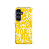 The Sol Dorado for Samsung by Statement Cases is a durable phone case featuring a bright yellow background adorned with an abstract white floral pattern, showcasing various flowers and leaves. Near the bottom edge, the text "STATEMENT CASE" highlights its dual-layer design for enhanced durability.