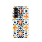 The Mediterranean Bloom for Samsung by Statement Cases features intricate, colorful floral patterns in blue, orange, and yellow. The design covers the entire back of the case, surrounding the camera cutout. Shock-absorbing and impact-resistant, it ensures protection while the brand "Statement Cases" is subtly printed near the bottom.