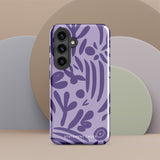 Introducing the Luna Morada for Samsung, a striking smartphone case from Statement Cases. This decorative purple cover boasts abstract floral and organic patterns in darker hues and is designed to absorb shocks. The impact-resistant case features a camera cutout that accommodates five lenses, with the brand name "STATEMENT CASES" elegantly printed at the bottom center.