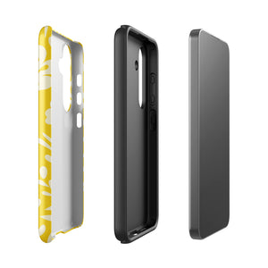 The Sol Dorado for Samsung by Statement Cases is a durable phone case featuring a bright yellow background adorned with an abstract white floral pattern, showcasing various flowers and leaves. Near the bottom edge, the text "STATEMENT CASE" highlights its dual-layer design for enhanced durability.