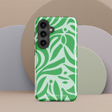 The Selva Verde for Samsung, a product by Statement Cases, is a durable, dual-layer phone case adorned with a green and white leafy design. The back of the case includes a camera cutout, and the bottom is printed with "Statement Cases.