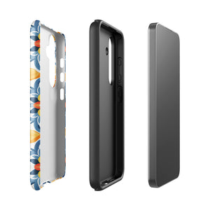 The Mediterranean Bloom for Samsung by Statement Cases features intricate, colorful floral patterns in blue, orange, and yellow. The design covers the entire back of the case, surrounding the camera cutout. Shock-absorbing and impact-resistant, it ensures protection while the brand "Statement Cases" is subtly printed near the bottom.