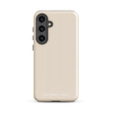 A beige smartphone case with vertical stripes designed for a phone with a triple camera setup. This impact-resistant phone case features precise cutouts for the cameras, buttons, and other essential functions. "Statement Cases" is printed at the bottom of the tough phone case. Product Name: Noble Pinstripe for Samsung